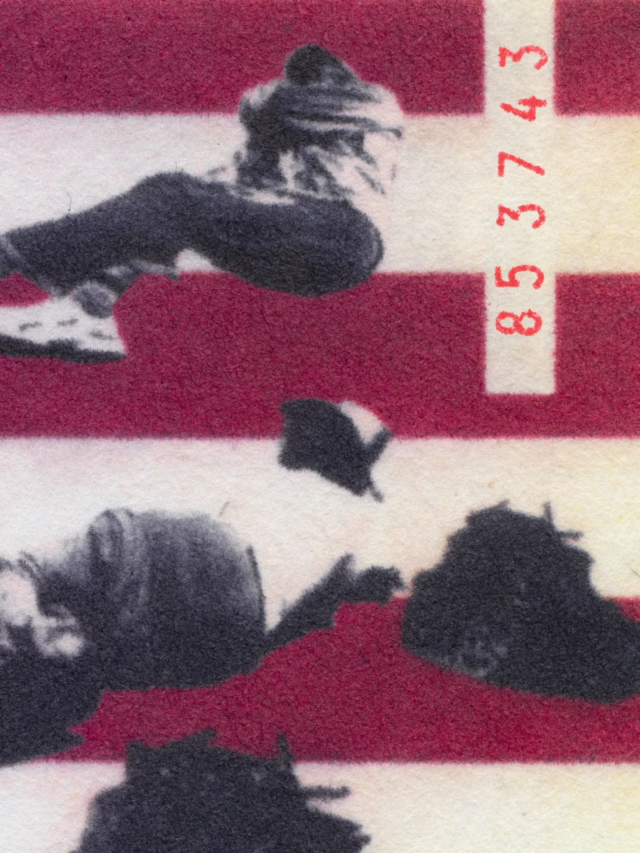 Assembly Line, 2025, by in vivo. Detail: cypher 853743 stamped in red beside a falling figure.